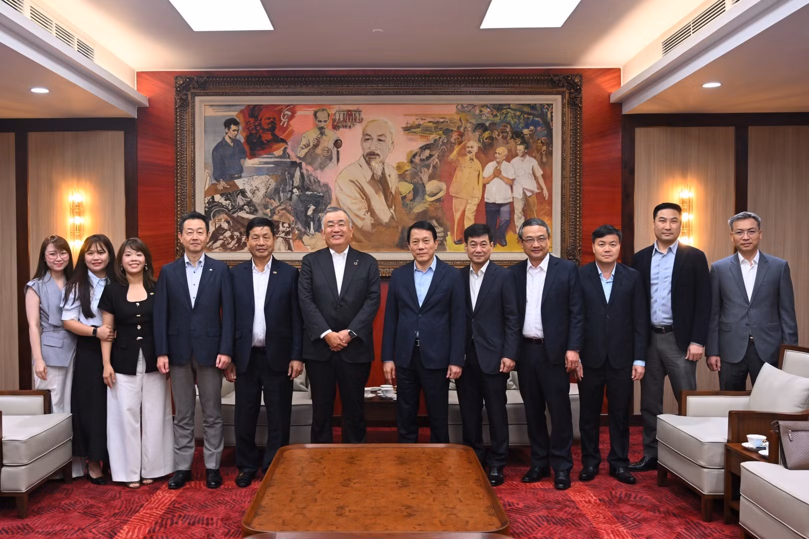 Delegates join group photo.