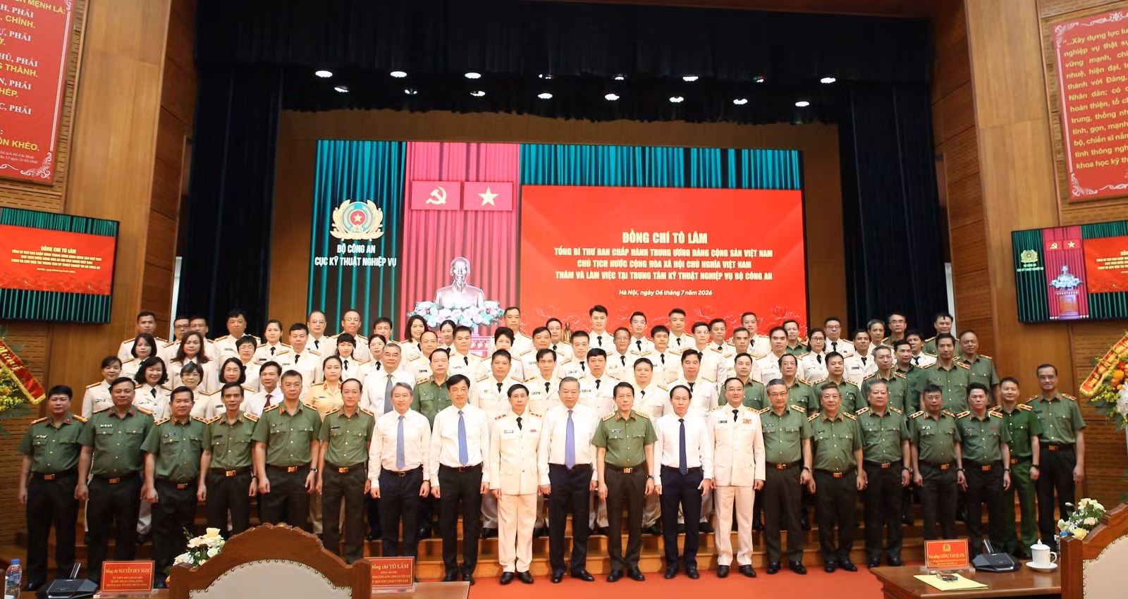 Delegates join group photo.