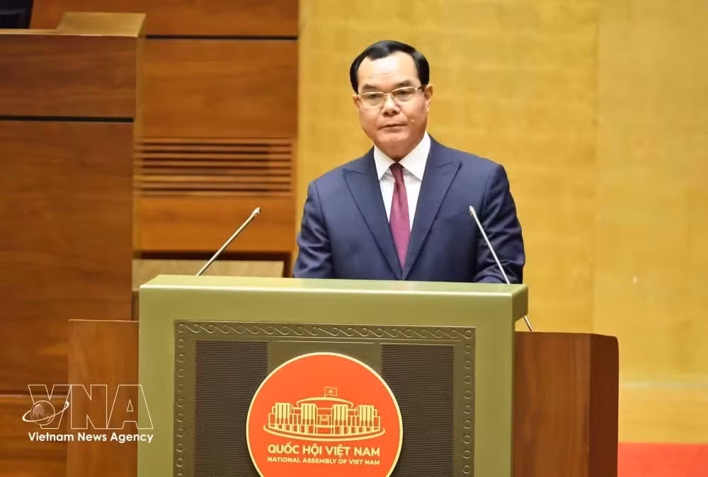 Minister of Ethnic and Religious Affairs Nguyen Dinh Khang delivers a report at a National Assembly's session (Photo: VNA)