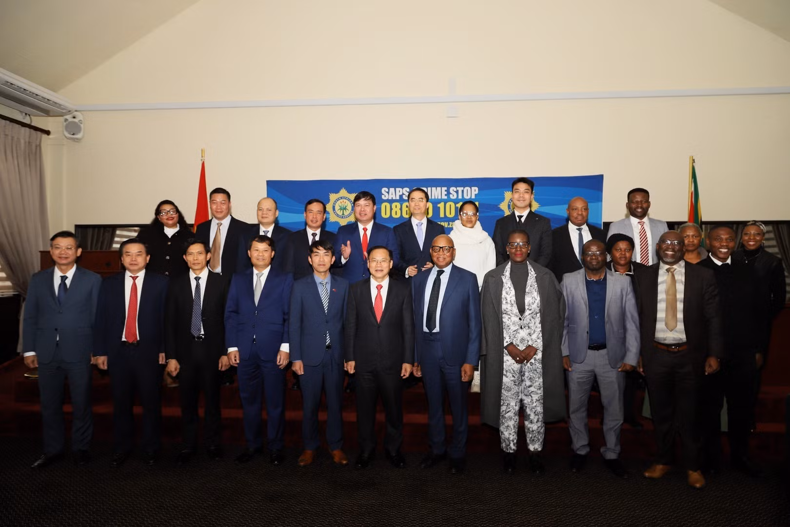 Delegates join group photo.