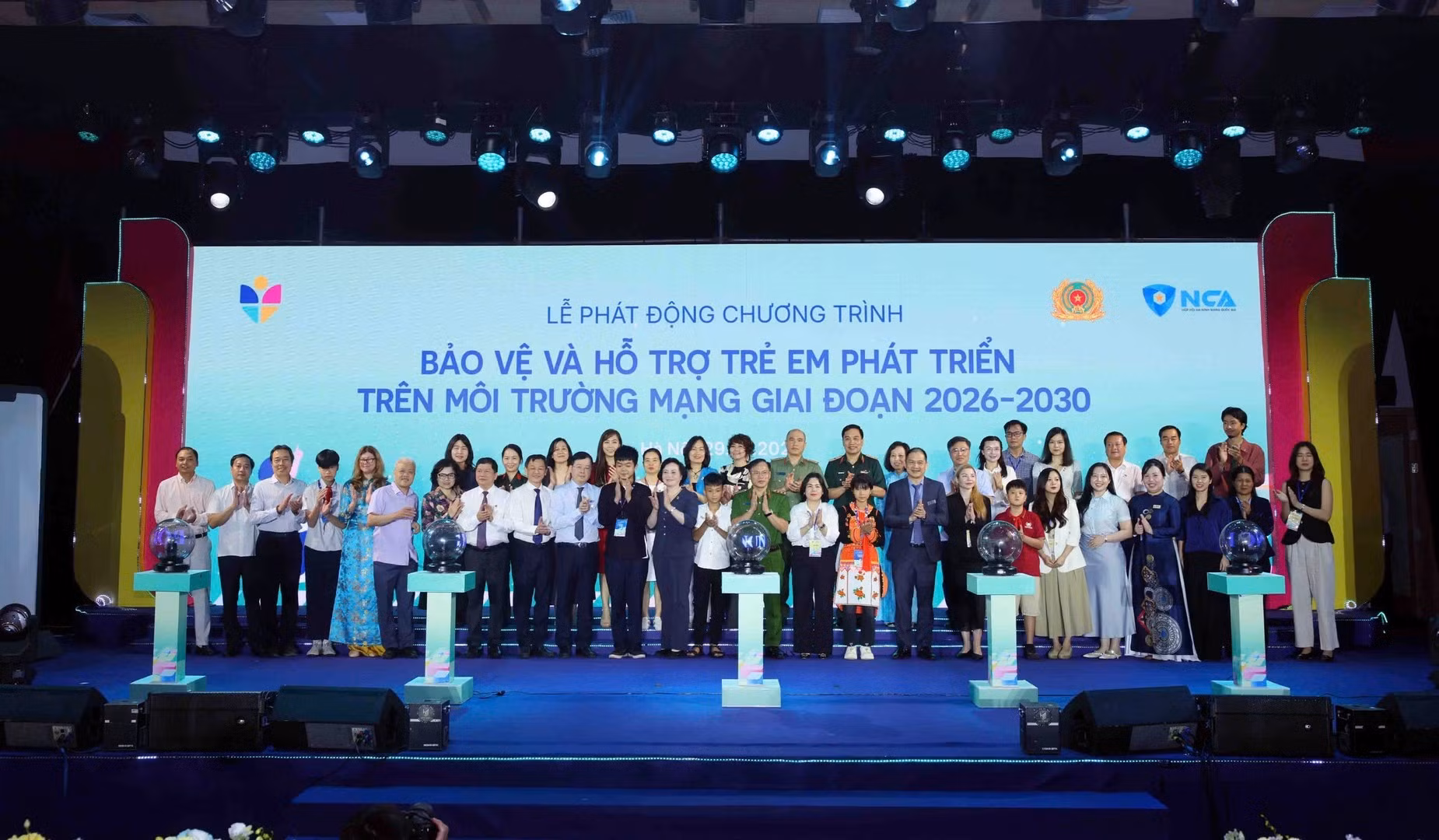 Delegates join group photo.