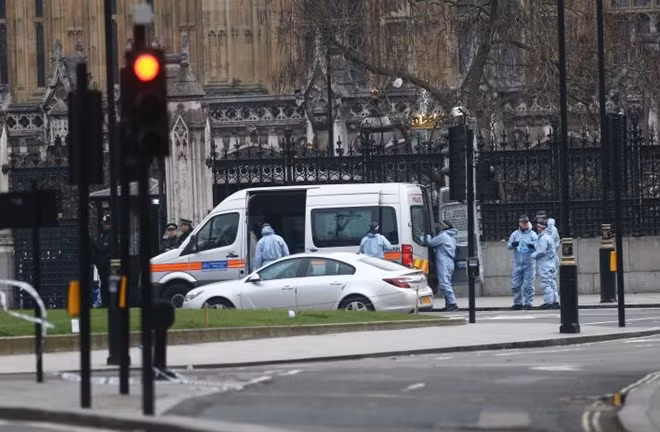 Police work at Carriage Gate outside the Houses of Parliament. REUTERS/Neil Hall