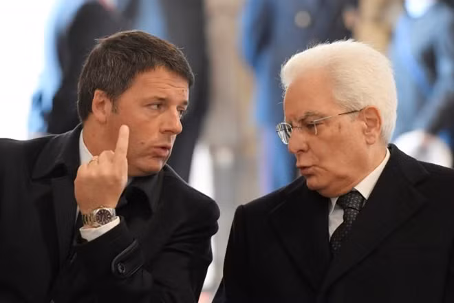 Italian Prime Minister Matteo Renzi talks to President Sergio Mattarella before a ceremony led by Pope Francis to close the Holy Door marking the closing of the Catholic Jubilee Year of Mercy in Saint Peter's Basilica at the Vatican November 20, 2016. REUTERS/Tiziana Fabi/Pool