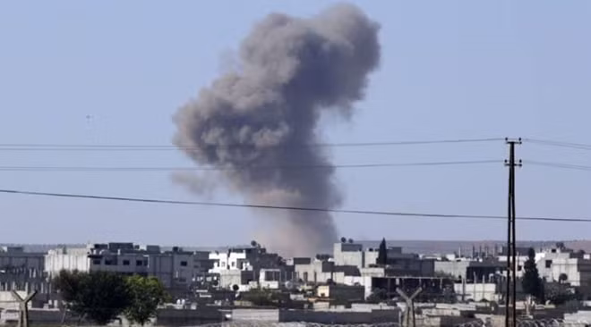 Syrian state media says U.S. hit army posts, U.S. denies ảnh 1