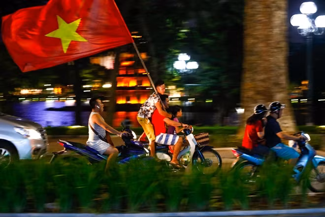 The streets were flooded with light flares, Vietnamese flags and cheering people.