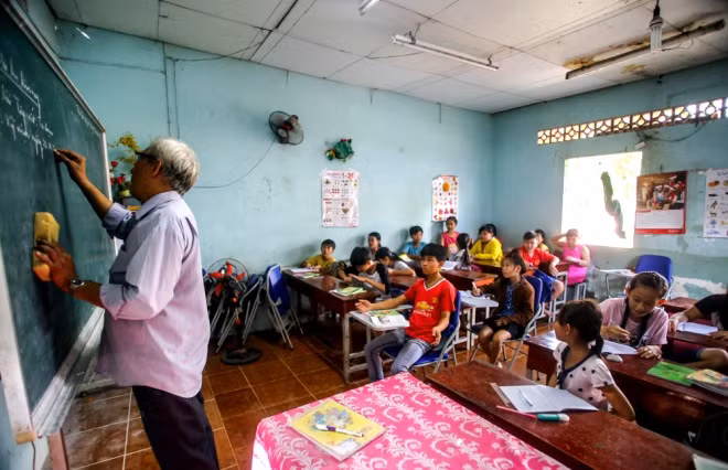 Huynh Van Phe and his students. Huynh Van Phe and his students.
