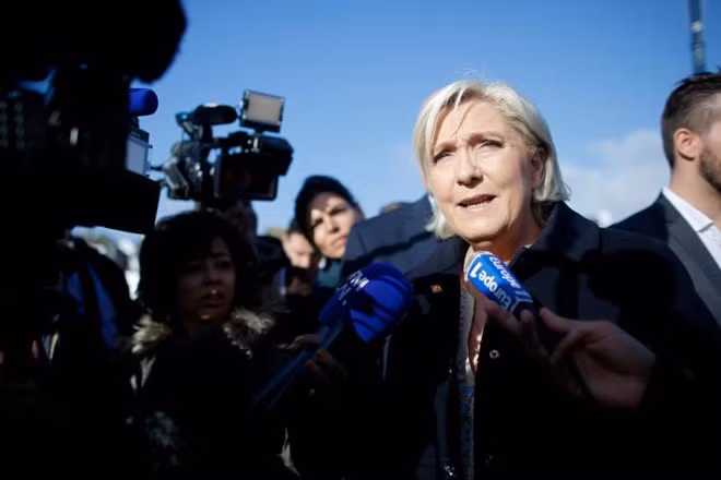 Marine Le Pen, French National Front (FN) political party leader and candidate for French 2017 presidential election talks to the media during a visit to a market in Concarneau, France, March 31, 2017. REUTERS/Stephane Mahe