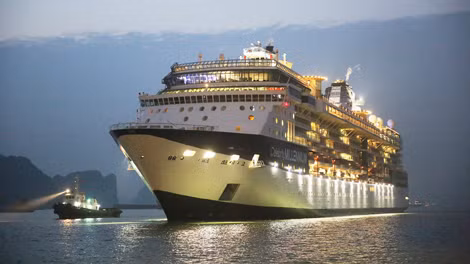 The cruise prepares to dock at the Hon Gai International Passenger Terminal. The cruise prepares to dock at the Hon Gai International Passenger Terminal.