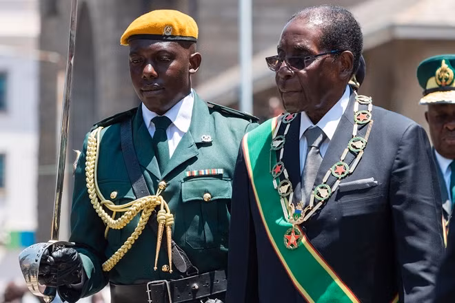 Fate of Zimbabwe's Mugabe (R) hangs in the balance amid coup confusion