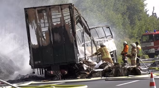 Firefighters are seen at the site where a coach burst into flames after colliding with a lorry on a motorway near Muenchberg, Germany in this still image taken from video on July 3, 2017. REUTERS/News 5