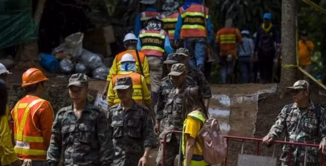 Thai diver dies as rescue teams ponder how to bring out trapped boys.