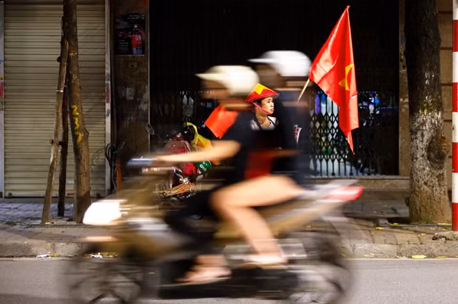 The streets were flooded with light flares, Vietnamese flags and cheering people.