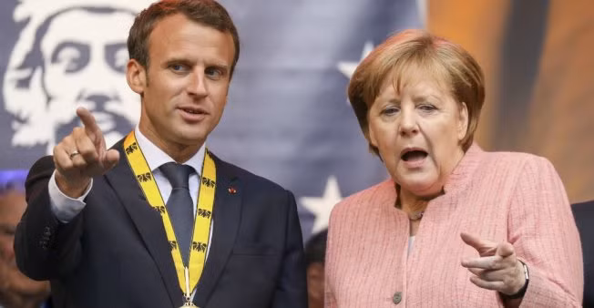 EU must defend firms against U.S. Iran sanctions: Macron ảnh 1