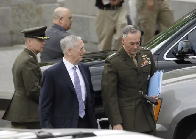 U.S. Defense Secretary James Mattis (C) and Joint Chiefs Chairman General Joseph Dunford (R) depart after briefing members of the U.S. Senate on North Korea at the White House in Washington, U.S, April 26, 2017. REUTERS/Kevin Lamarque