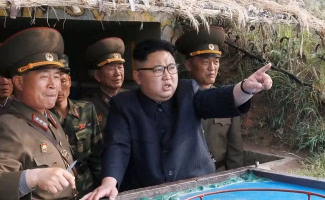 DPRK's leader has delayed a decision on firing missiles towards Guam while he waits to see what the United States does next, the DPRK's state media said on Tuesday.