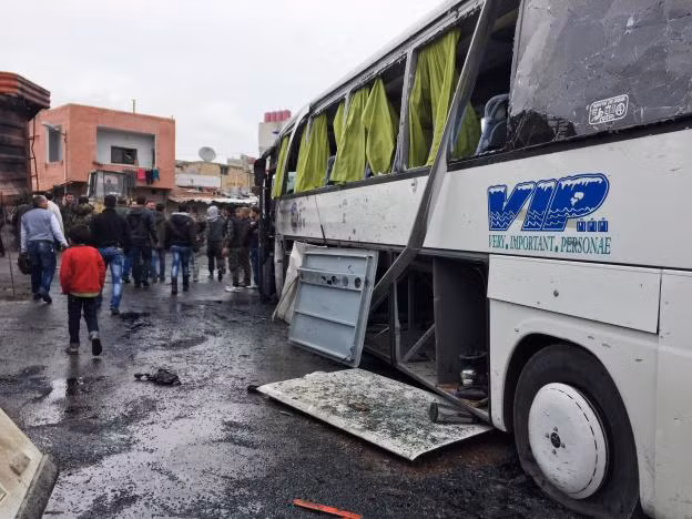 People inspect the damage at the site of an attack by two suicide bombers in Damascus, Syria March 11, 2017. REUTERS/Omar Sanadiki