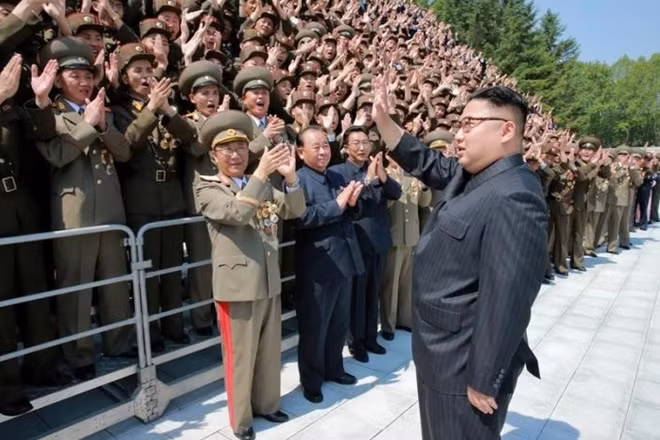 North Korean leader Kim Jong Un waves to North Korean scientists and technicians, who developed missile 'Hwasong-12' in this undated photo released by North Korea's Korean Central News Agency (KCNA) May 20, 2017. KCNA/via REUTERS