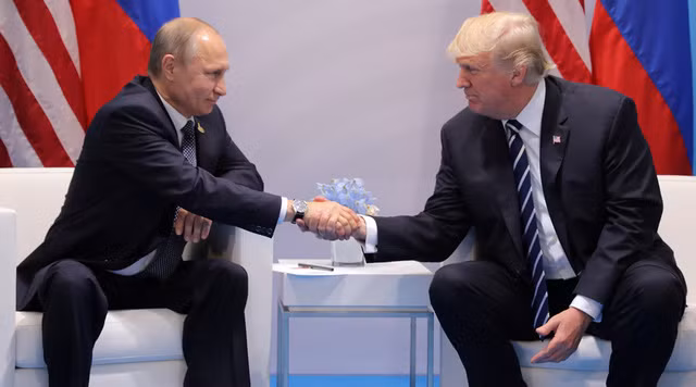 U.S. President Donald Trump shakes hands with Russian President Vladimir Putin during the their bilateral meeting at the G20 summit in Hamburg, Germany July 7, 2017. REUTERS/Carlos Barria