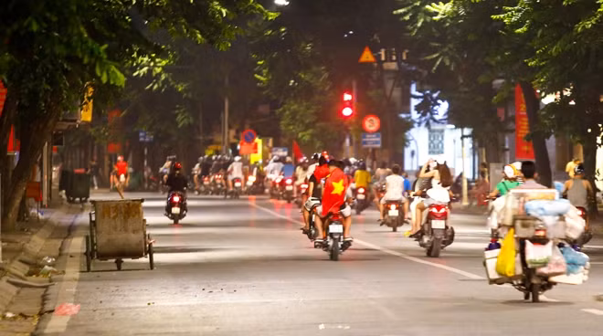 The streets were flooded with light flares, Vietnamese flags and cheering people.