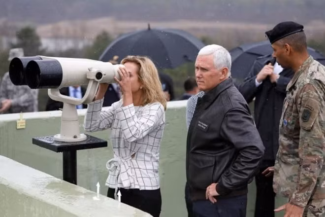 U.S. Vice President Mike Pence stands next to her daughter looking toward the north through a pair of binocular from an observation post inside the demilitarized zone separating the two Koreas, in Paju, South Korea, April 17, 2017. REUTERS/Kim Hong-Ji.