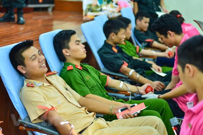 Young police officers donating blood.