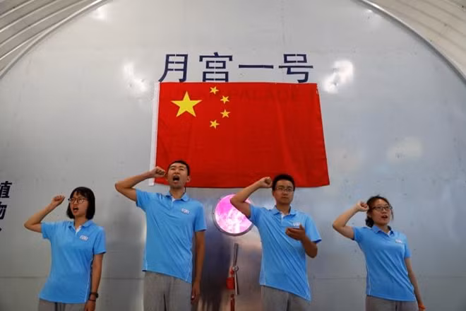Volunteers take an oath before entering a simulated space cabin in which they will temporarily live as a part of the scientistic Lunar Palace 365 Project, at Beihang University in Beijing, China July 9, 2017. REUTERS/Damir Sagolj