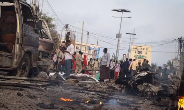 People at the scene of an attack by al-Shabaab in November last year in Mogadishu. Photograph: Abdirazak Hussein Farah/Getty Images