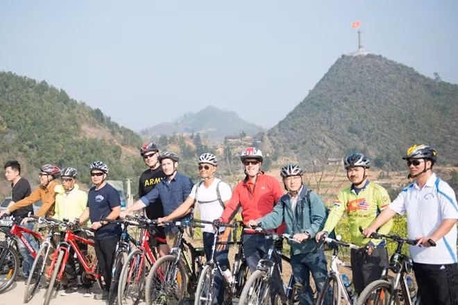 The U.S. Embassy delegation bikes from Cot Co Lung Cu to a nearby Lo Lo village