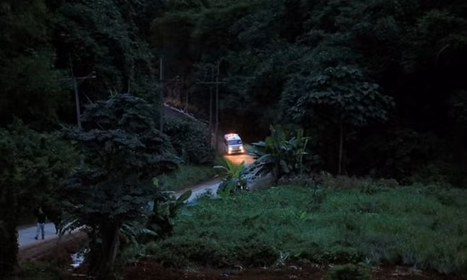 Emergency car leaving the scene.