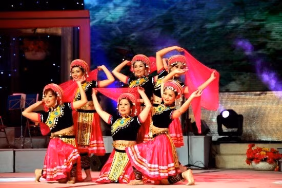 Colour in motion: Artists from Cao Bang Art Troupe perform on stage. The National Song and Dance Festival will gather 12 troupes from northern provinces between June 29 and July 7.