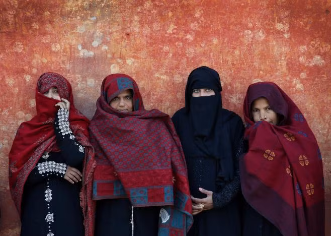 People queue to cast their vote during the state assembly election, in the village of Kairana, in the state of Uttar Pradesh, India, February 11, 2017. REUTERS