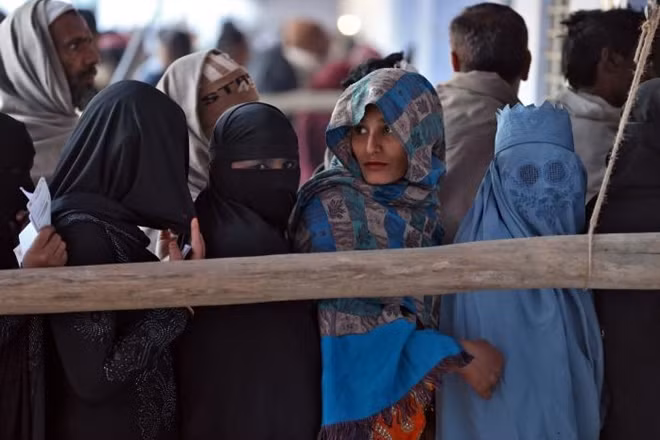 People queue to cast their vote during the state assembly election, in the village of Kairana, in the state of Uttar Pradesh, India, February 11, 2017. REUTERS