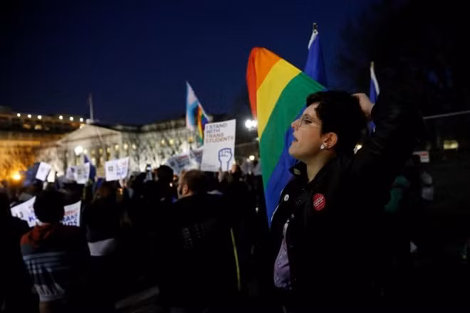 Transgender activists and supporters protest potential changes by the Trump administration in federal guidelines issued to public schools in defense of transgender student rights, near the White House in Washington, U.S. February 22, 2017. REUTERS/Jonathan Ernst