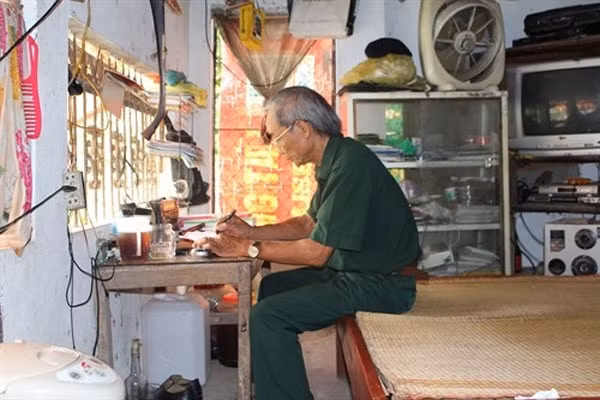 Life’s work: Chieng studies, updates and simplifies the legal information as well as decisions and plans of local authorities before playing the report to local people.