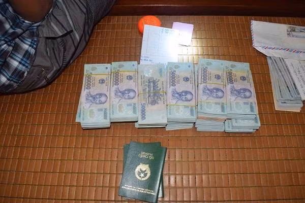 Cash found during a raid by the local police. Photo courtesy of local police