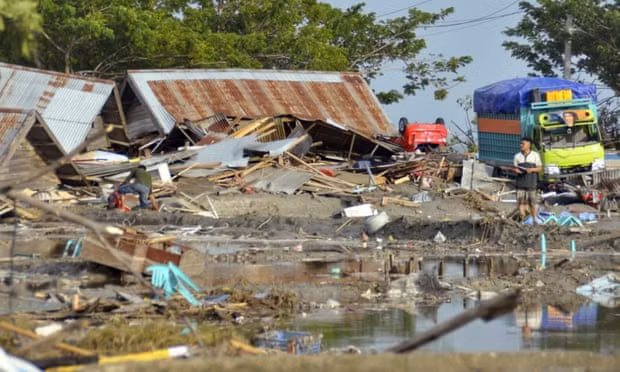A man stands amid the damage caused by a tsunami in Palu, Central Sulawesi, Indonesia, on Saturday. Photograph: AP
