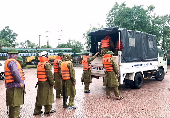 Police officers deployed to help local dealing with the floods.