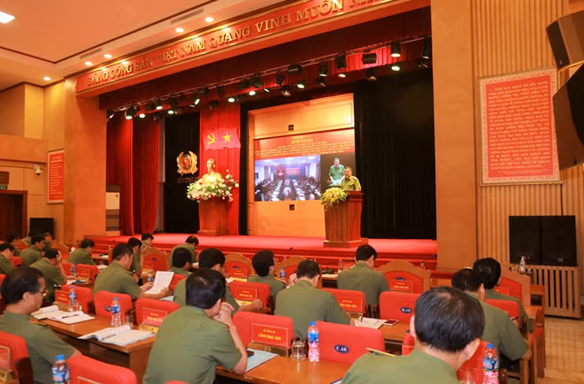 Major General To An Xo delivers a report at the meeting.