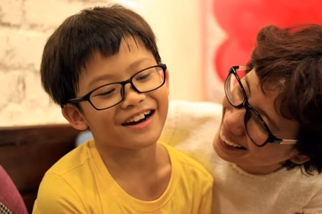 Thien Nhan and his godmother Mai Anh.