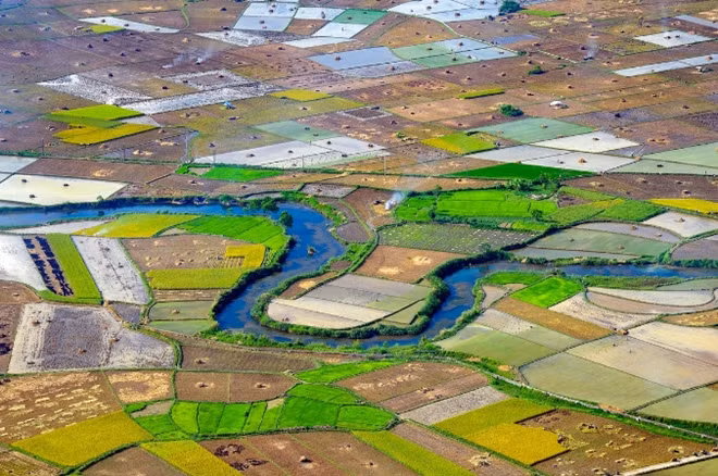 The rice season in Bac Son Valley starts later lthan most areas, leaving a mosaic of paddy fields and rivers.