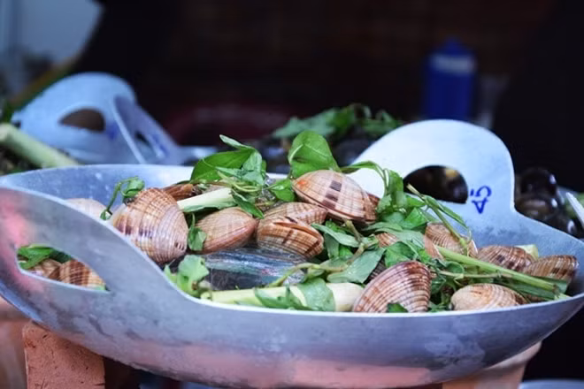Visitors can taste dishes served at stands.