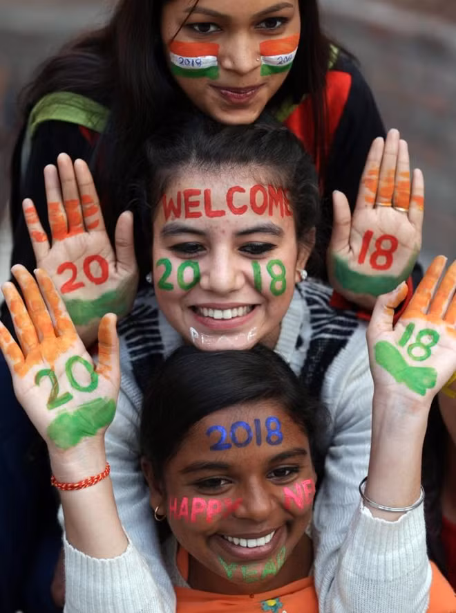 Three friends pose in Amritsar, India, to welcome in 2018