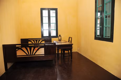 The room located in the second floor of the house is the place in which our Uncle Ho lived and worked for 16 days. Its area is only 12.2 square meters.