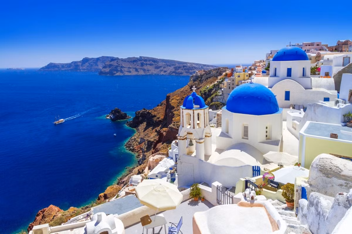 Oia of Greece is a traditional village that is most notable for being home to beautiful blue domed churches, sun-bathed verandas, a number of art galleries, and a maze of small shops. Indeed, almost all of them feature panoramic views of the nearby port of Ammoudi and of the Santorini volcano. (Photo:&nbsp;Patryk Kosmider / shutterstock.com)