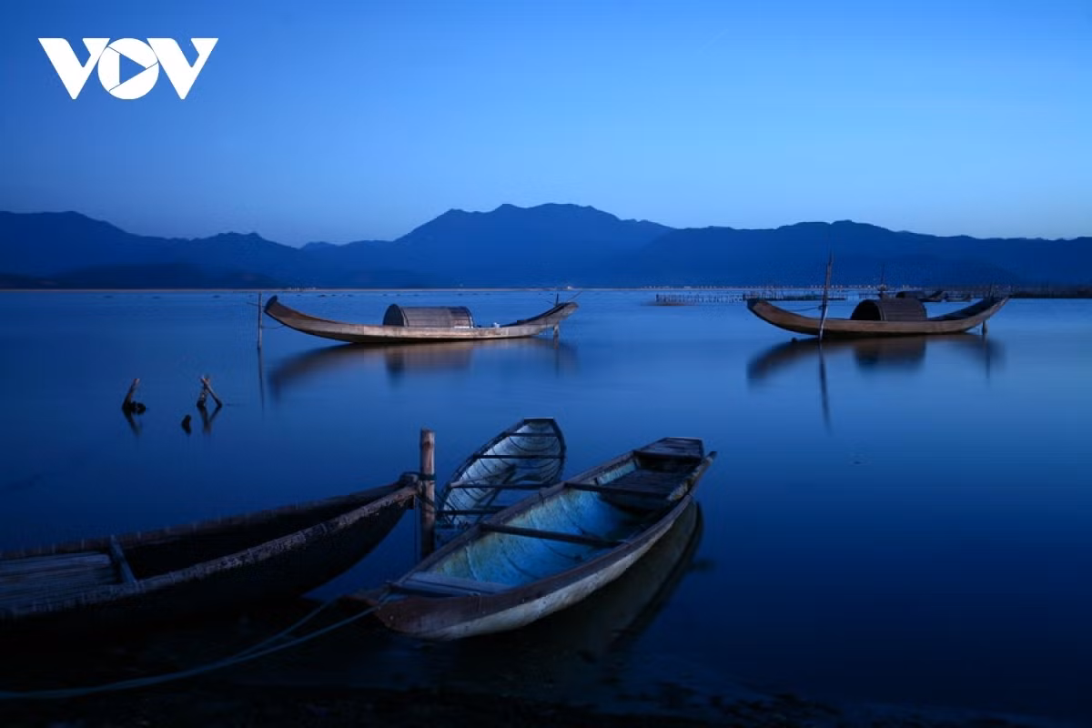 The area seems vastly different at night, with some parts looking very quiet as boats drift on the water.