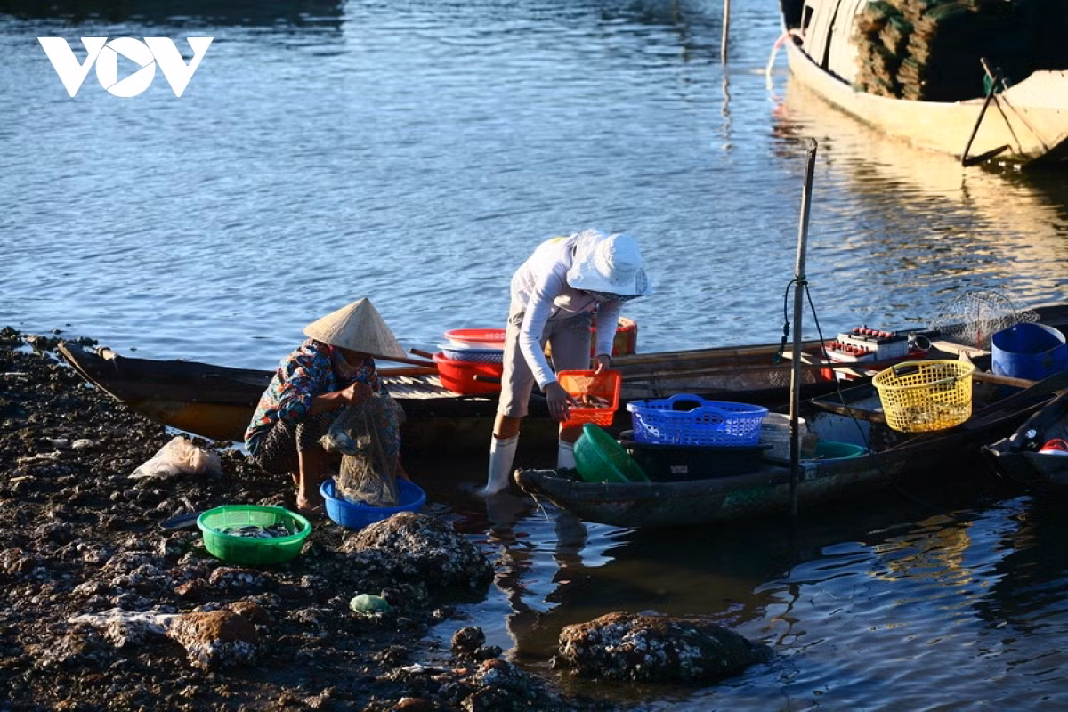 Several local people purchase goods.