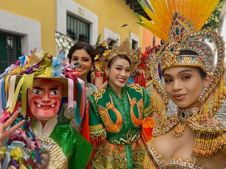 Do Thi Ha (third from left) joins other contestants as they pose on the streets of Puerto Rico to prepare for the Dances of the World segment which will be broadcast as part of the grand final of the 2021 Miss World pageant on December 17.