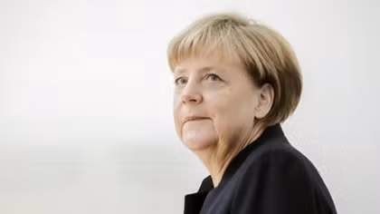 Germany's Merkel says she has not changed course on migrant policy