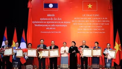 Friendship orders presented to Lao NA collectives, individuals