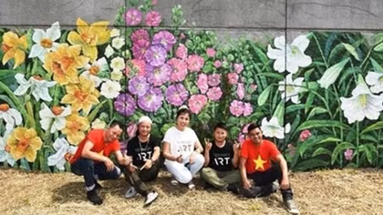 French, Vietnamese flowers featured on dyke wall along Seine river bank